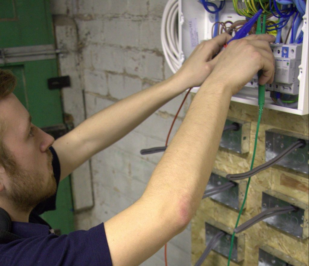 Image of Electrician Testing Fuse board